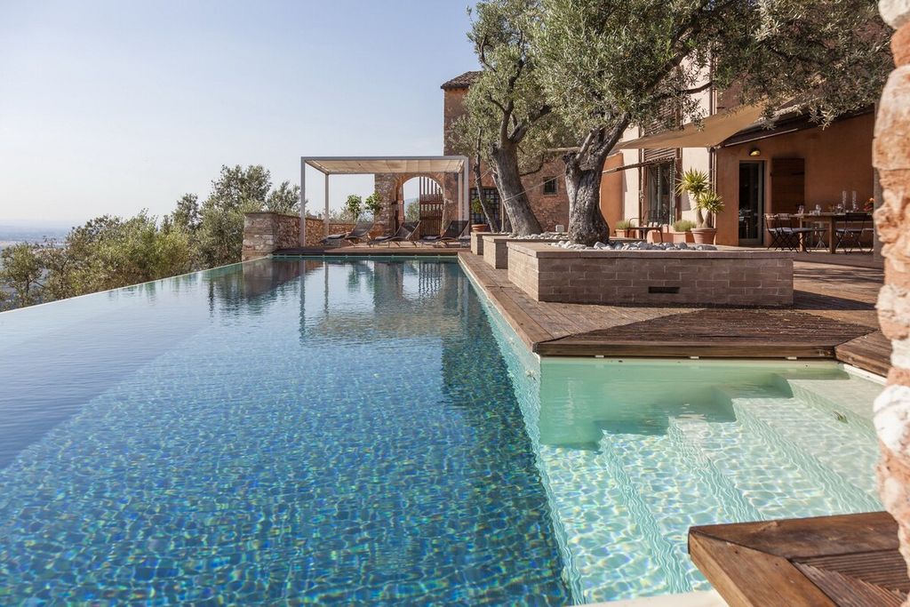 Image may contain Pool Water Swimming Pool Resort Hotel and Building