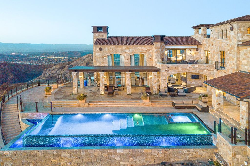 Image may contain Building Hotel Resort Pool Water Housing Villa House Mansion and Swimming Pool