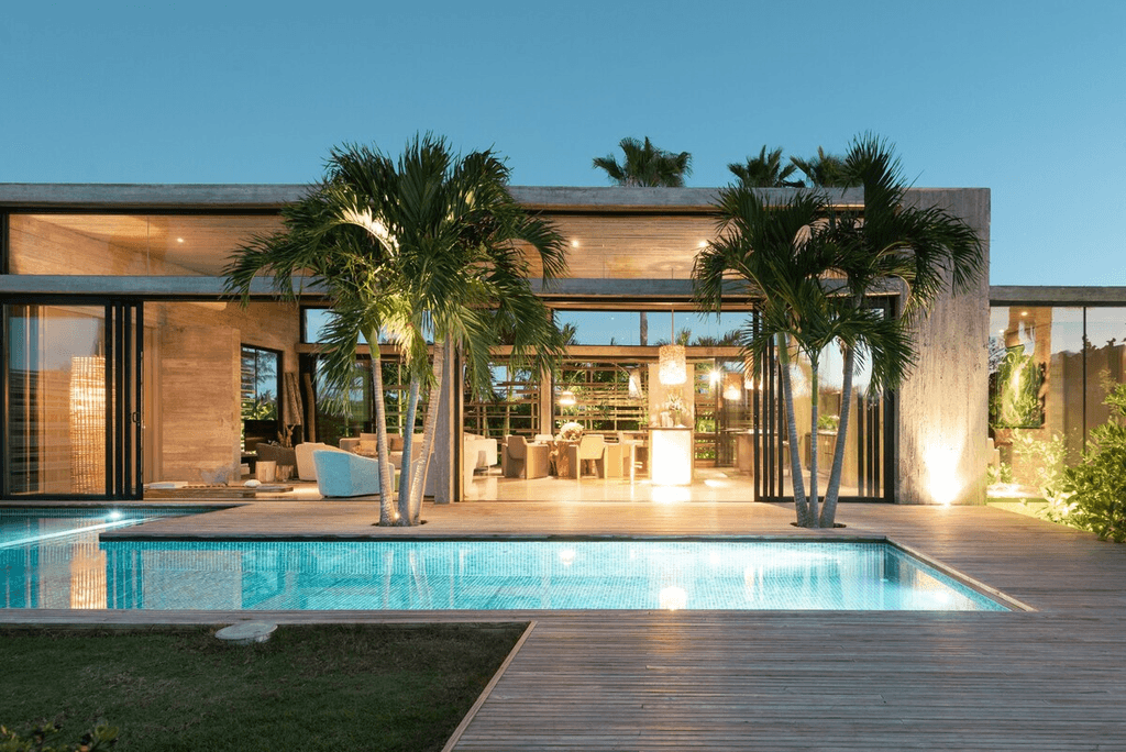Image may contain Pool Water Housing Building Villa House Swimming Pool Arecaceae Plant Palm Tree Tree and Hotel