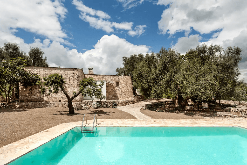 Image may contain Villa House Building Housing Hotel Hacienda Resort Pool and Water