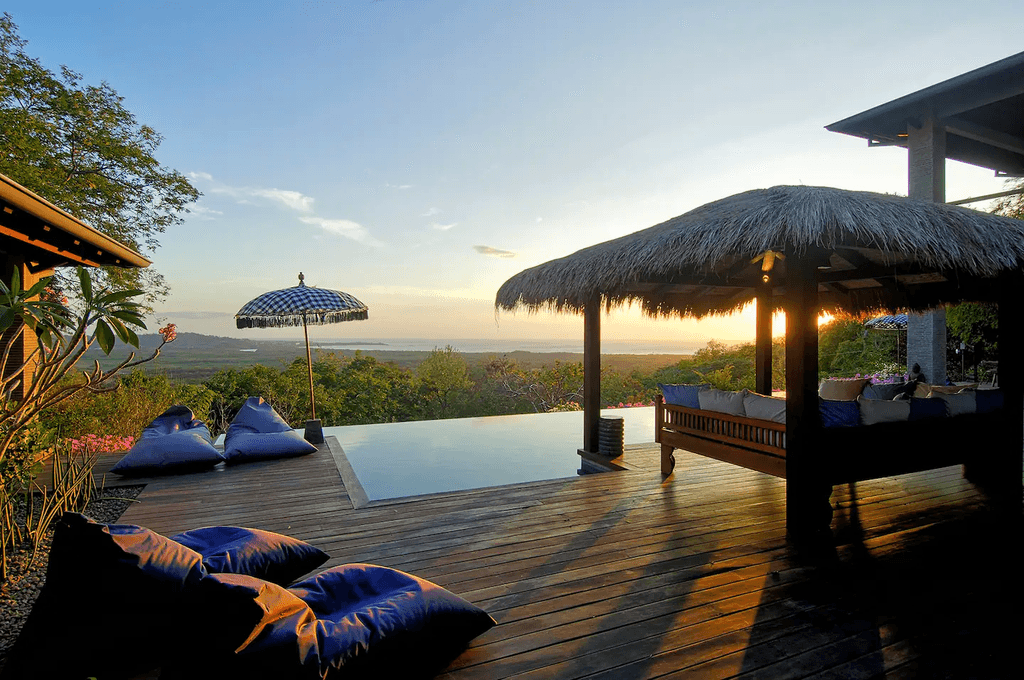 Image may contain Resort Hotel Building Furniture Couch Cushion Pillow and Water