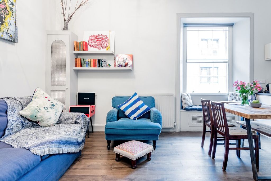 Image may contain Room Indoors Bedroom Furniture Chair Living Room Interior Design Dorm Room Couch and Flooring