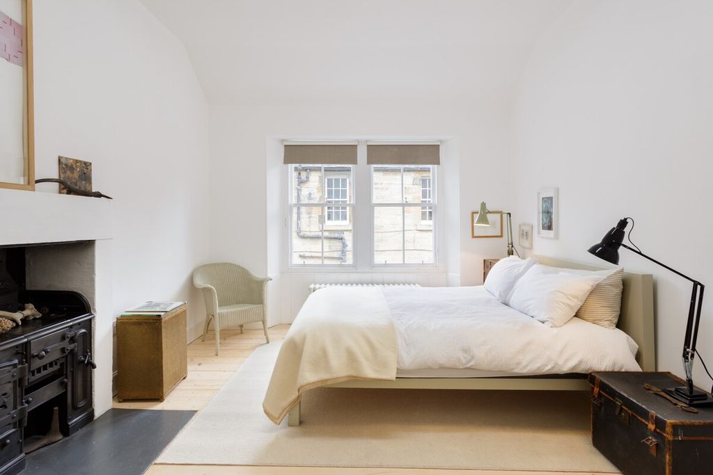 Image may contain Indoors Room Bedroom Furniture Bed Chair Dorm Room and Wood