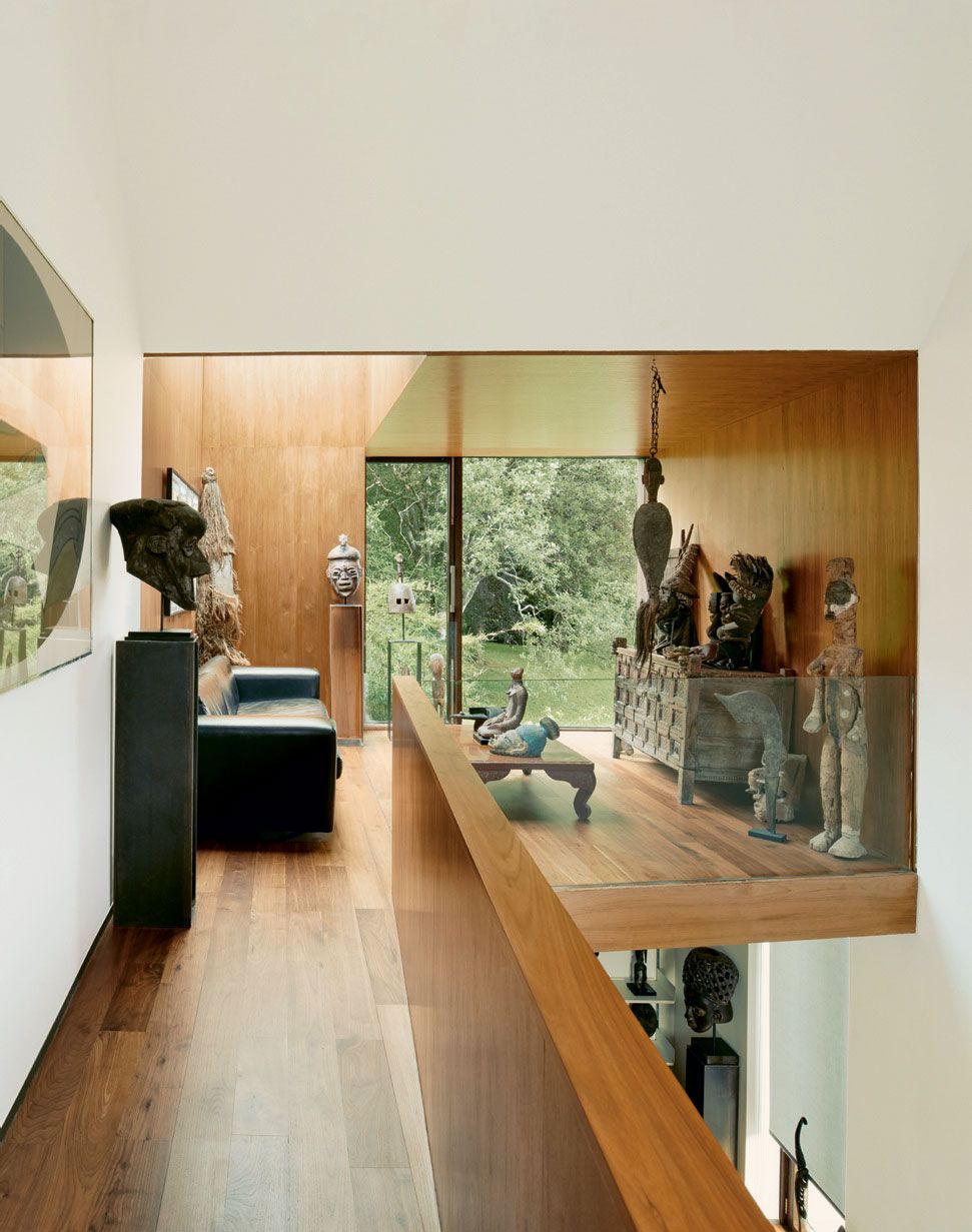 Tribal art is displayed in an upstairs gallery.