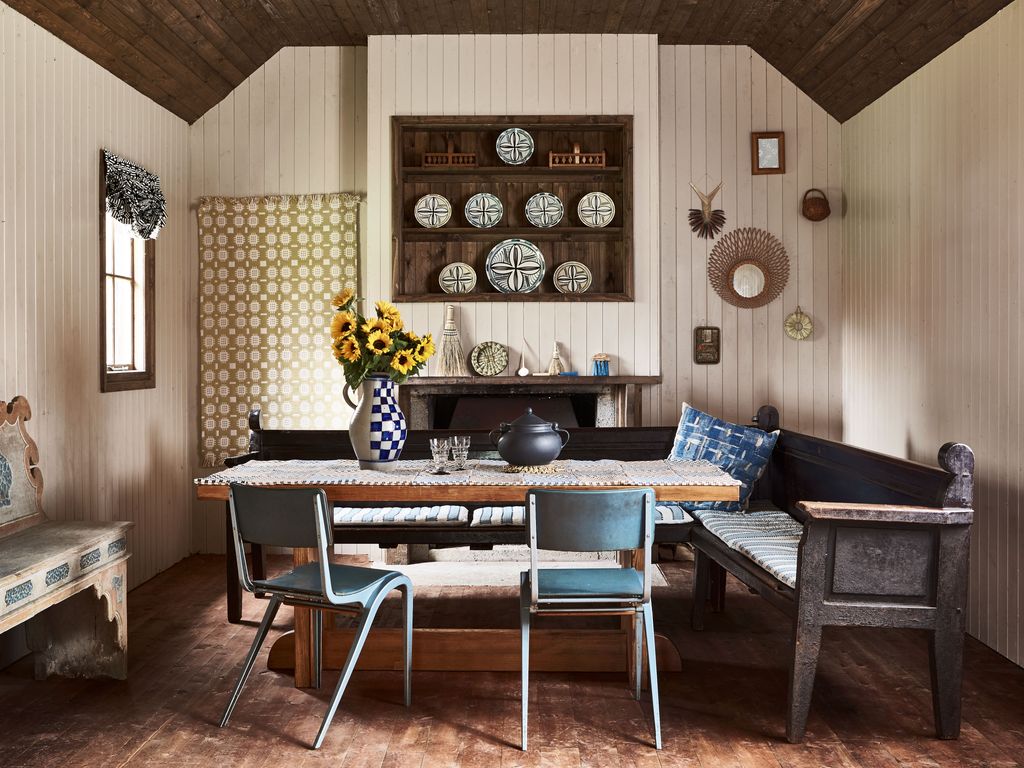 Image may contain Wood Flooring Hardwood Living Room Room Indoors Furniture Interior Design Chair and Table