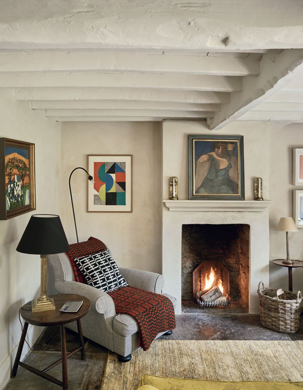 nbspA painting by Welsh artist Will Roberts rests on the mantel shelf with a geometric artwork by Sonia Delaunay to the...