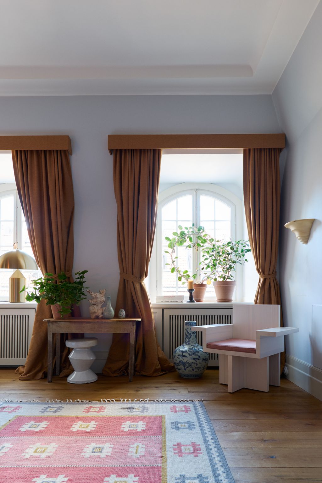 Image may contain Flooring Wood Living Room Room Indoors Furniture Rug Home Decor Floor and Hardwood