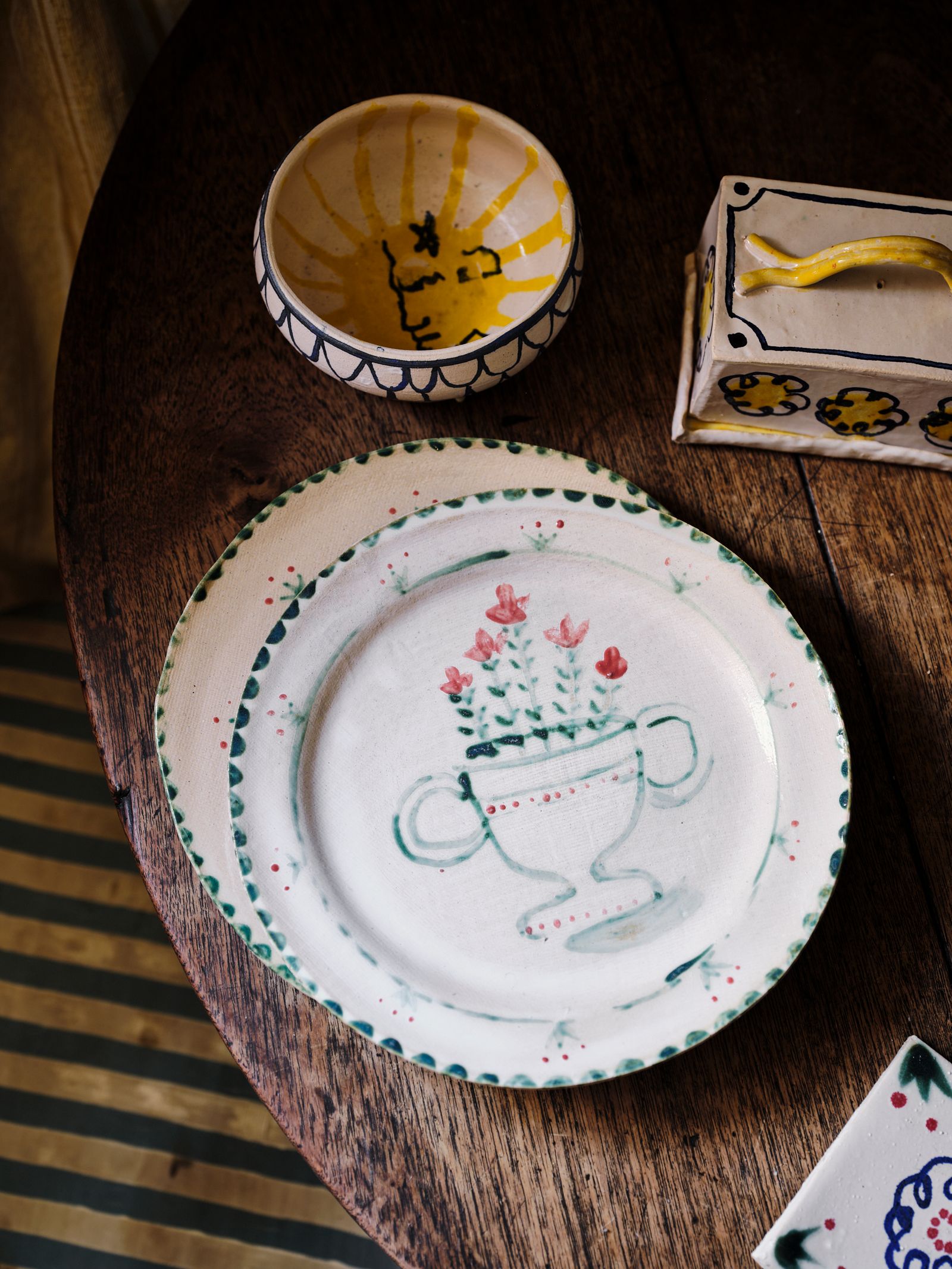 Image may contain Food Dish Meal Porcelain Art Pottery Saucer Clock Tower Architecture Tower Building and Bowl