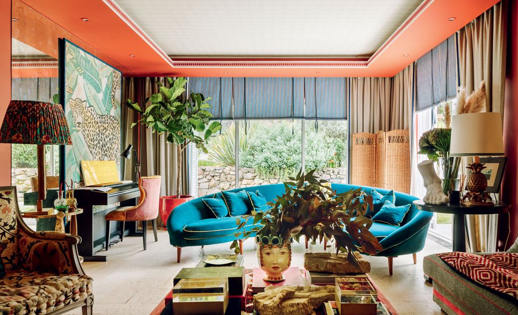 Image may contain Living Room Indoors Room Couch Furniture Chair Lobby and Table