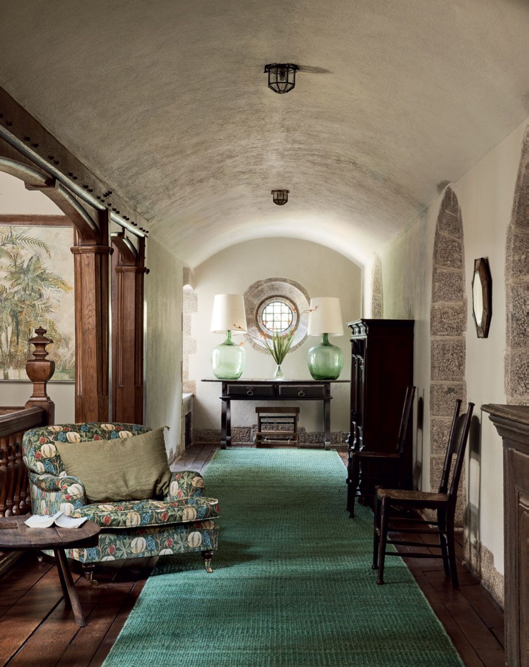 Image may contain Furniture Living Room Room Indoors Chair Couch Flooring Floor Interior Design Corridor and Lobby