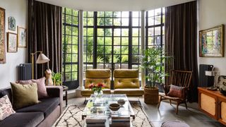 Image may contain Furniture Table Living Room Room Indoors Coffee Table Chair Lobby Couch and Rug