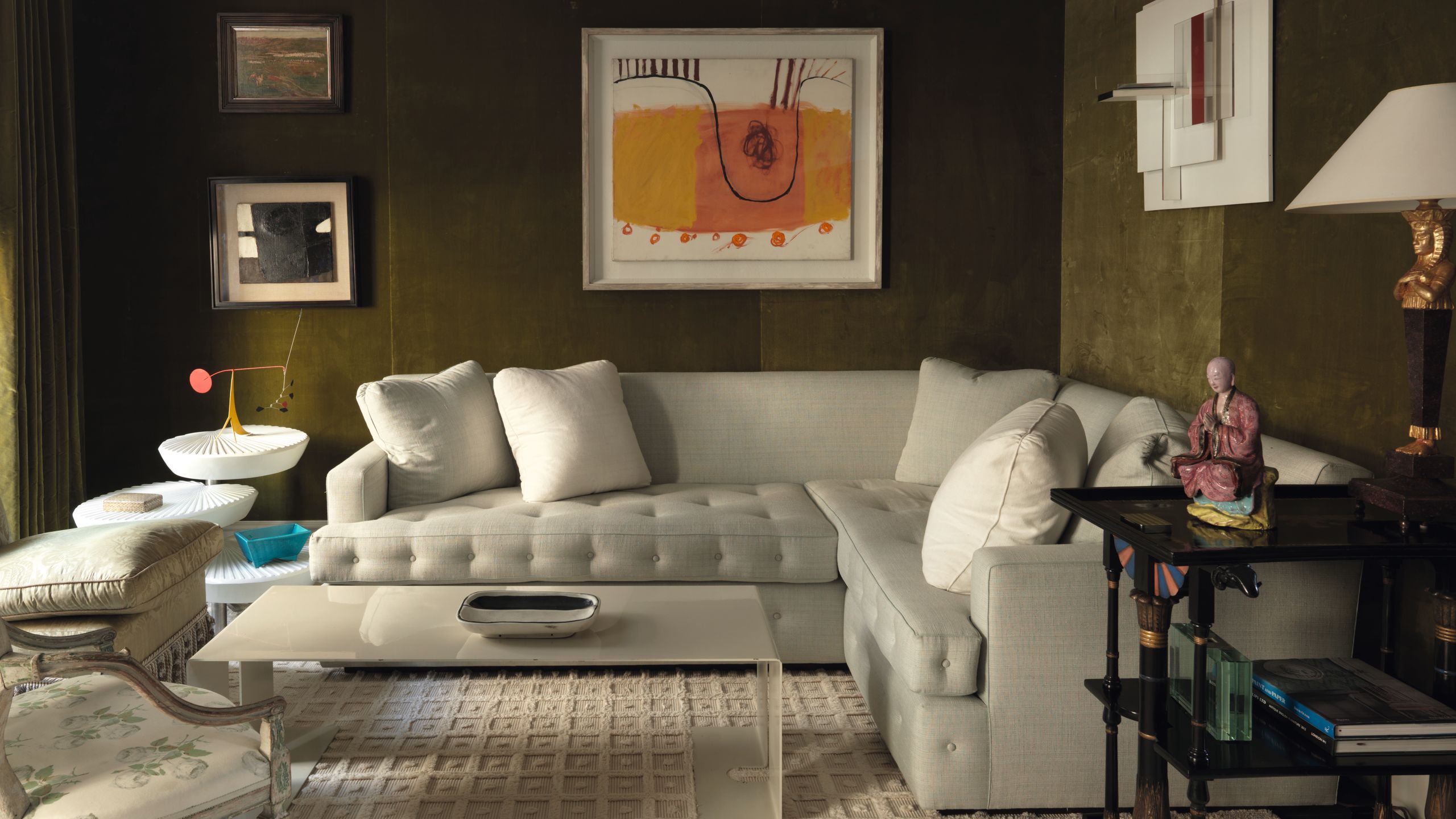 Image may contain Living Room Room Indoors Furniture Couch Table Human Person Interior Design Coffee Table and Rug