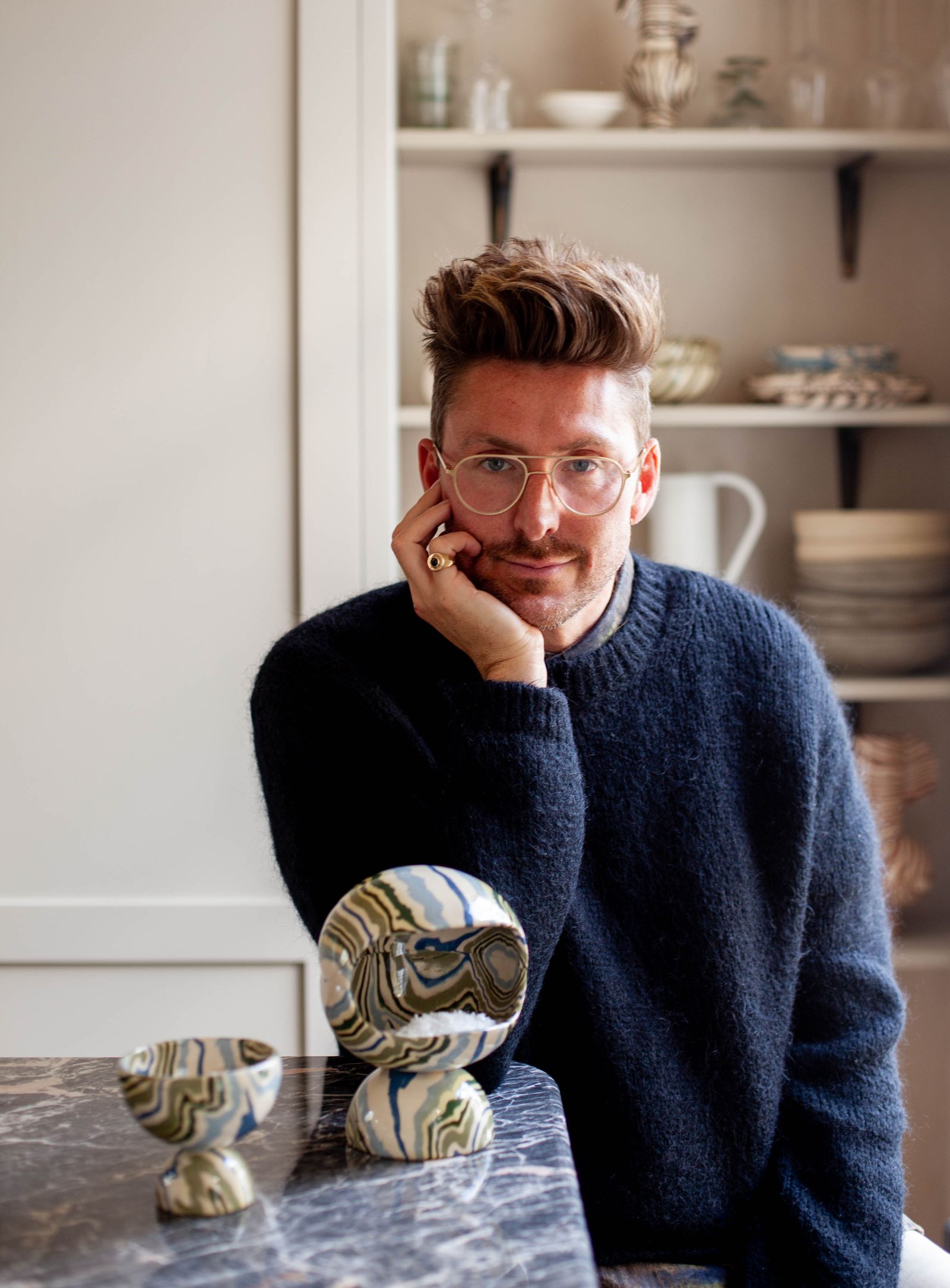 Image may contain Clothing Apparel Henry Holland Human Person Sweater Shelf Glasses Accessories and Accessory