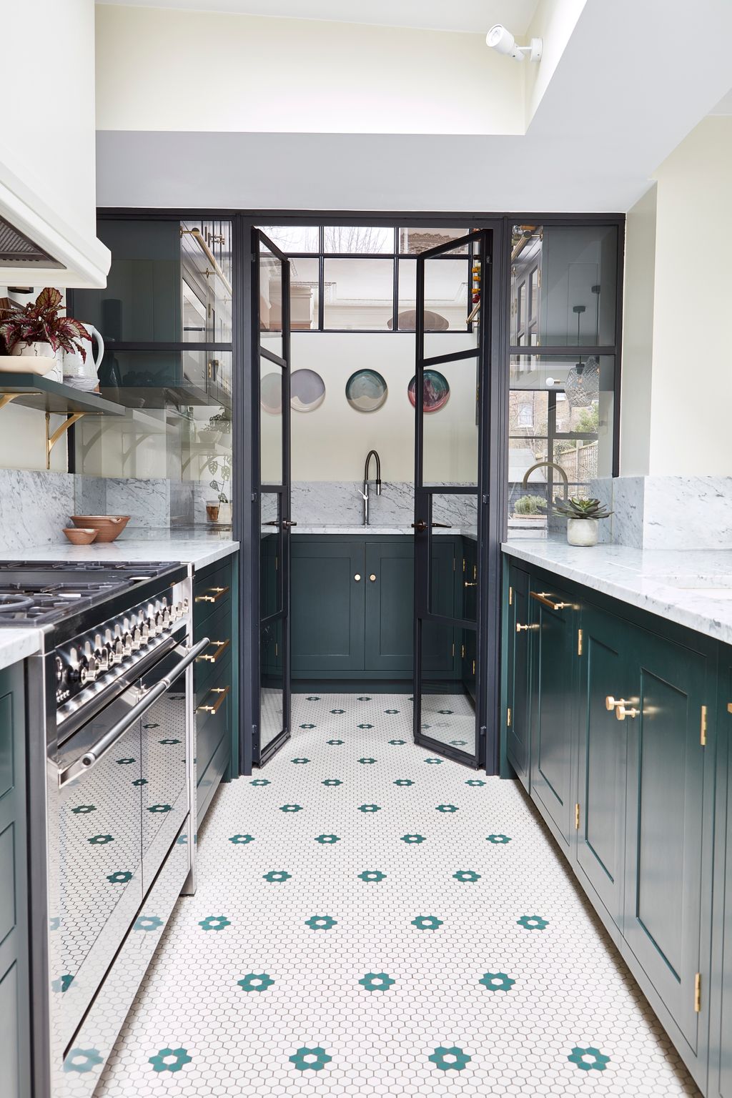 Blakes London avoided having a dark awkward corner in this kitchen by sectioning it off with steelframed glass doors and...