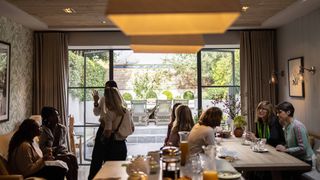 Image may contain Restaurant Food Court Food Human Person Cafe Cafeteria and Meal