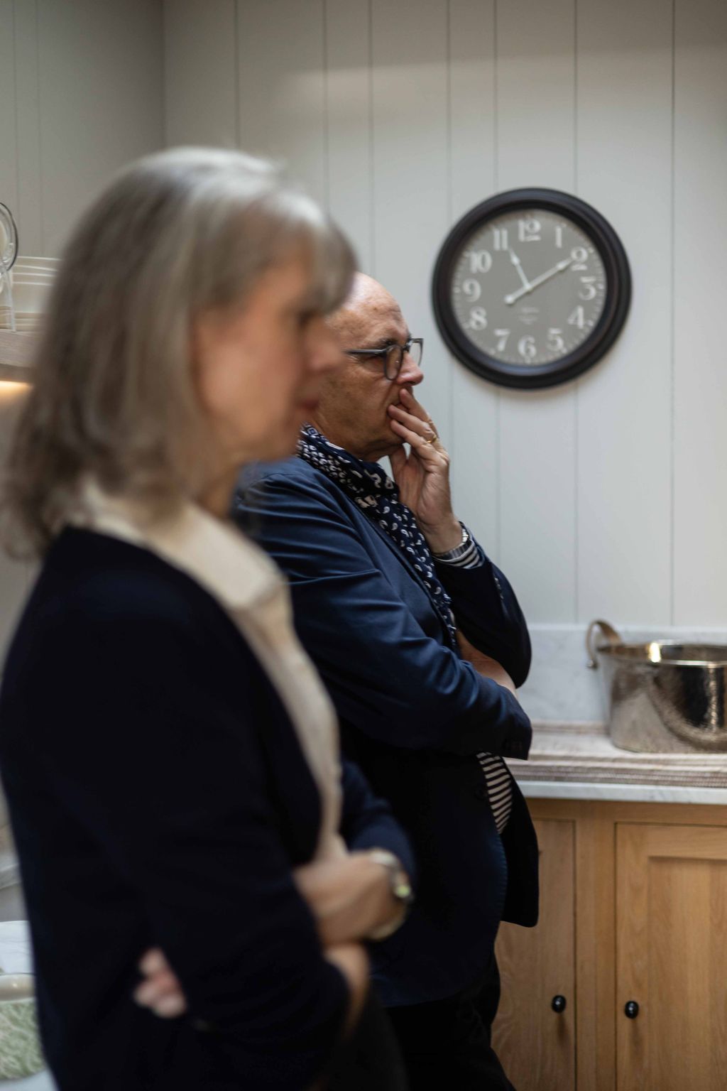 Image may contain Human Person Room Indoors Clock Tower Architecture Tower Building Sitting and Glasses