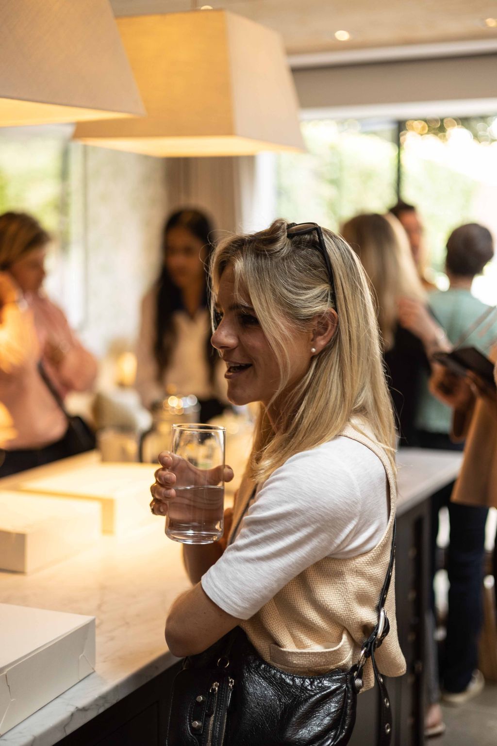 Image may contain Human Person Sitting Dating Restaurant Pub Bar Counter Glass Drink and Beverage