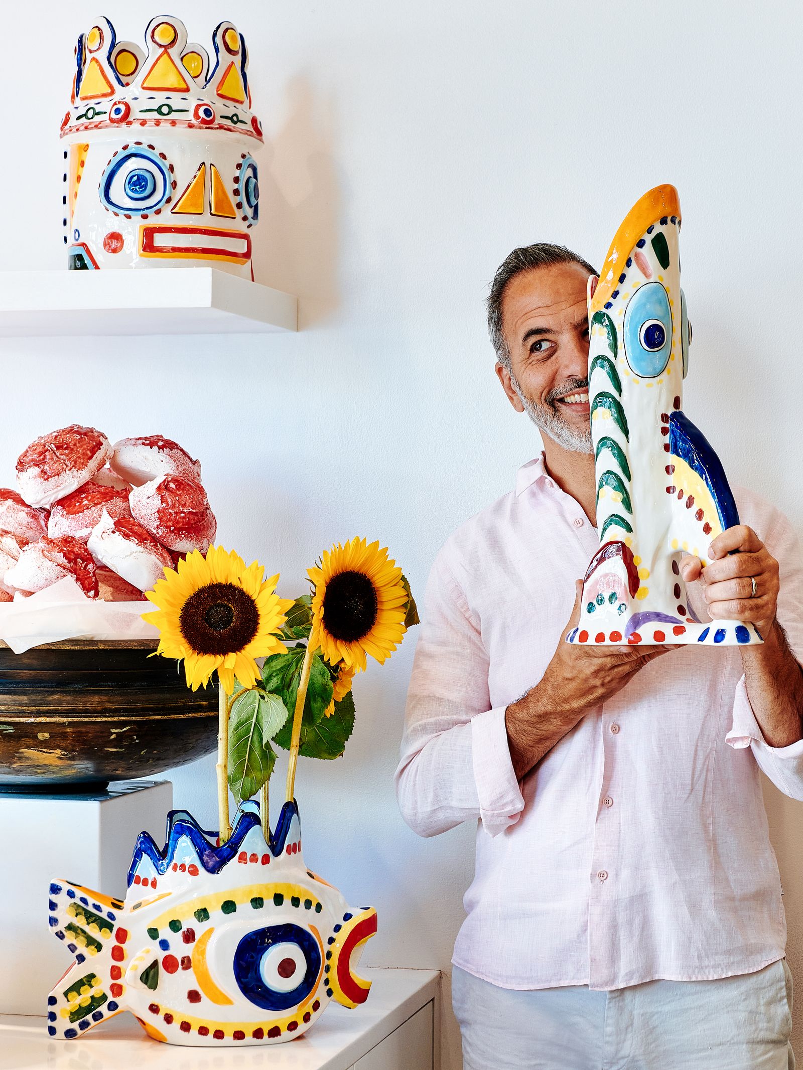 Yotam posing with ceramics from his ‘Sicily collection produced in collaboration with artist Ivo Bisignano and Belgian...