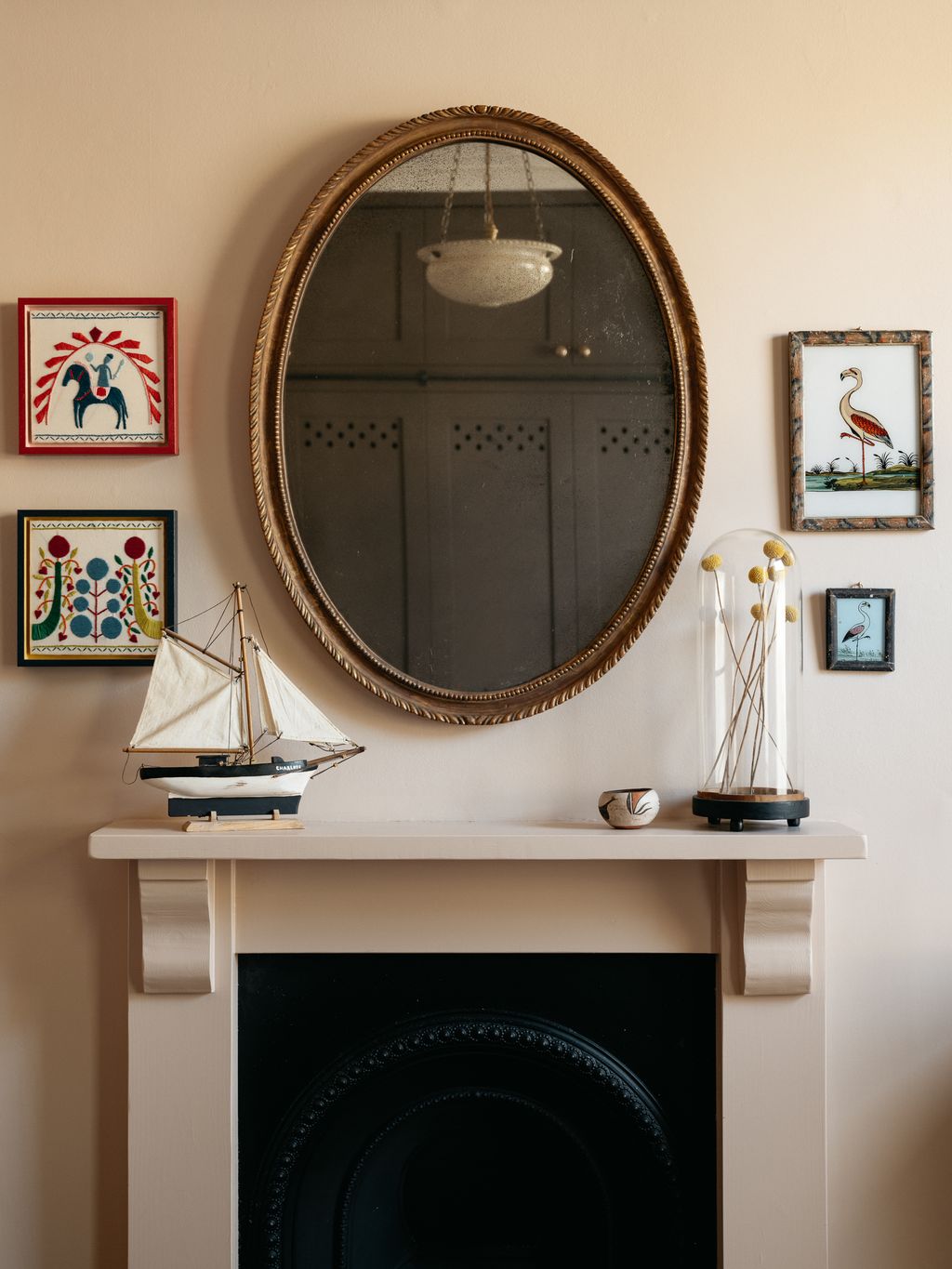 The Italian alabaster ceiling light just glimpsed in the mirror is from the 1920s and was sourced from Carlton Davidson.