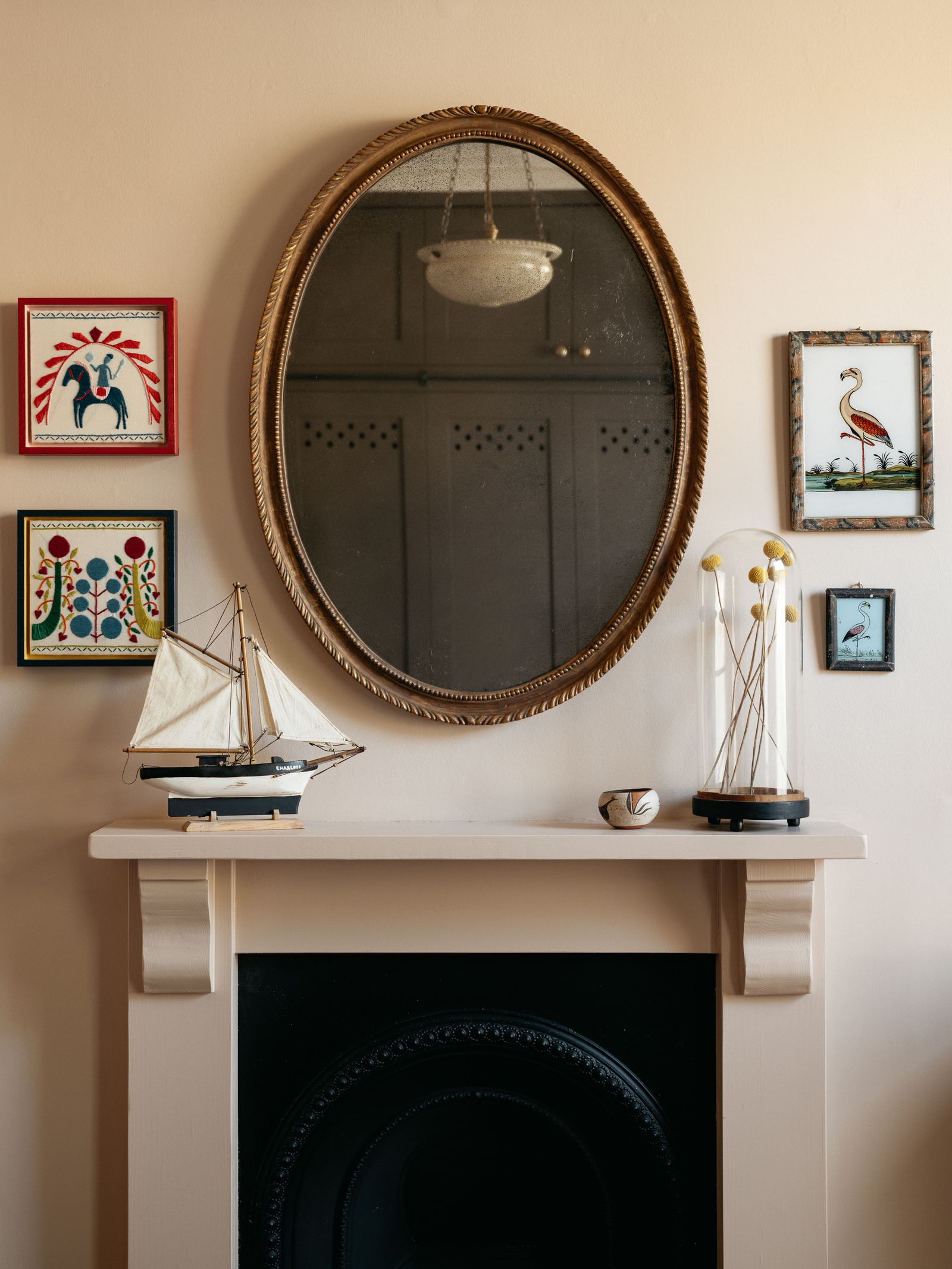 Framed embroidery hanging in the bedroom of Charlotte Boundy's London house