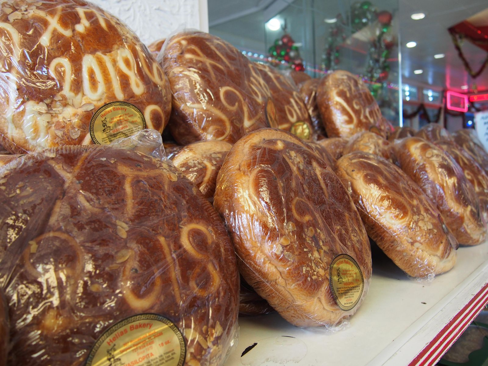 MDJR0J Greek New Year's Day Bread on display at Hellas Bakery in Tarpon Springs Florida USA 2017 © Katharine Andriotis