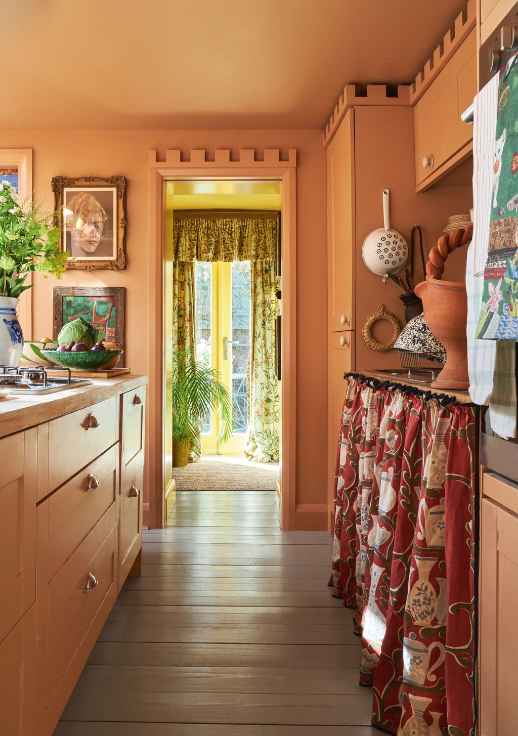 The crenellation detail designed by Benedict and the oversized Victorian ceramic cabinet handles lend the existing...