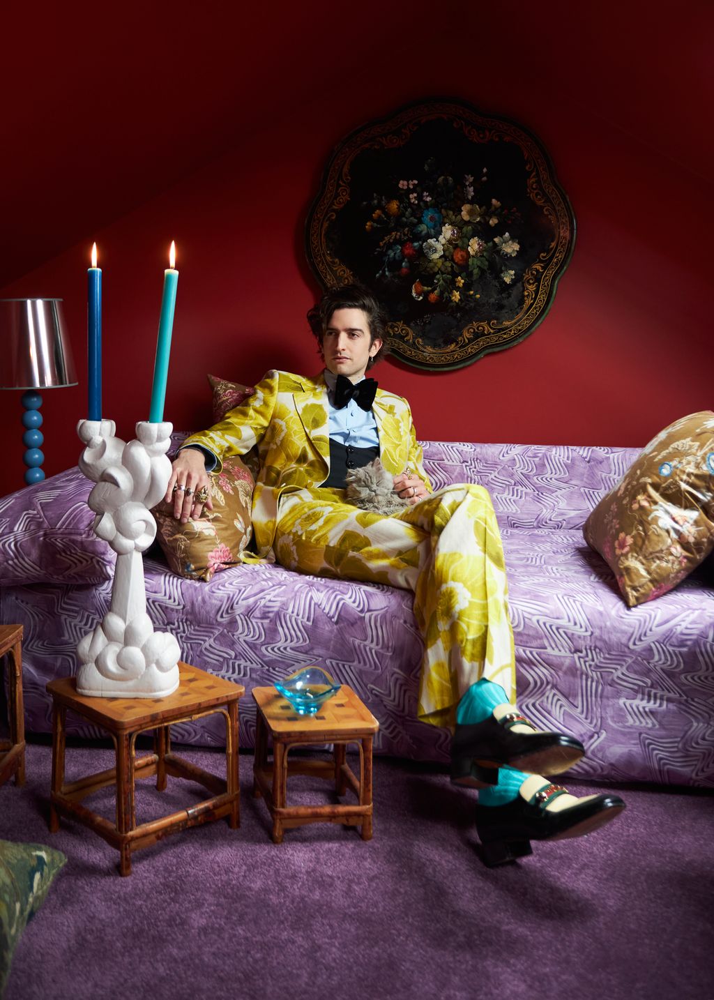 Max sits with his cat Count Vronsky.