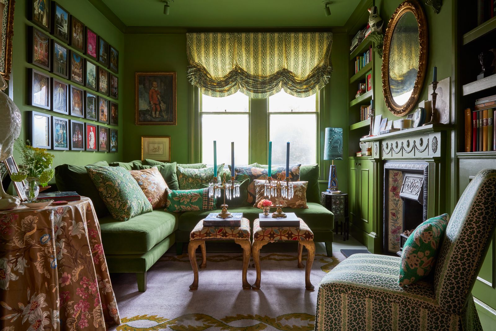 The sitting room at Max Hurd's London house designed by Benedict. “The full bleed green colour scheme is based on Mark...
