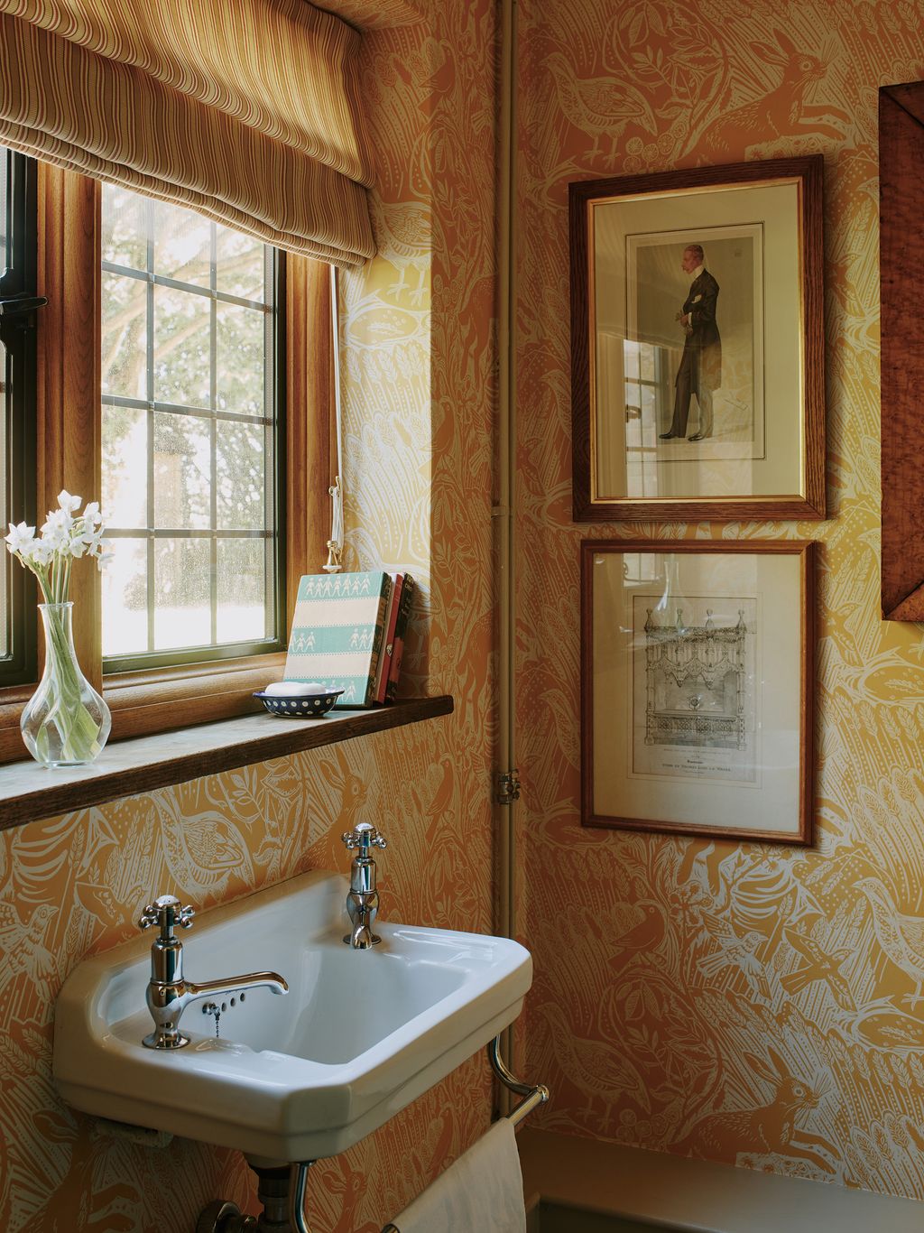 The downstairs loo is papered in St Jude's ‘Harvest Hare Corn and paired with a blind from Madeaux's ‘Covehurst Stripe 05.