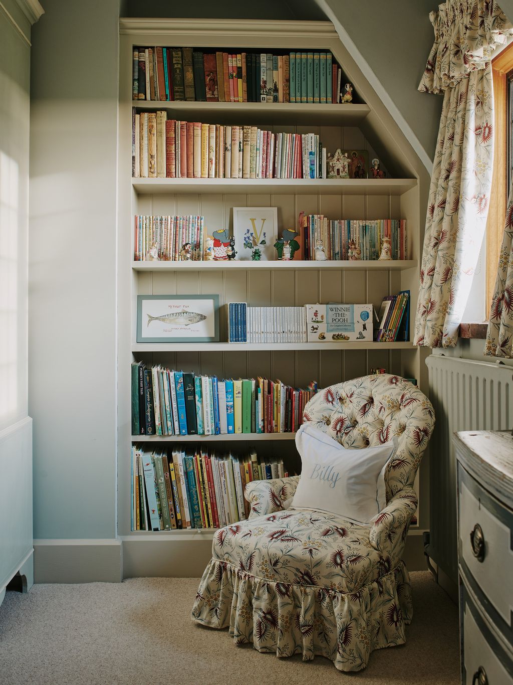 In this cosy reading nook the curtains and upholstery are Octavia Dickinson's ‘Edie Yellow.
