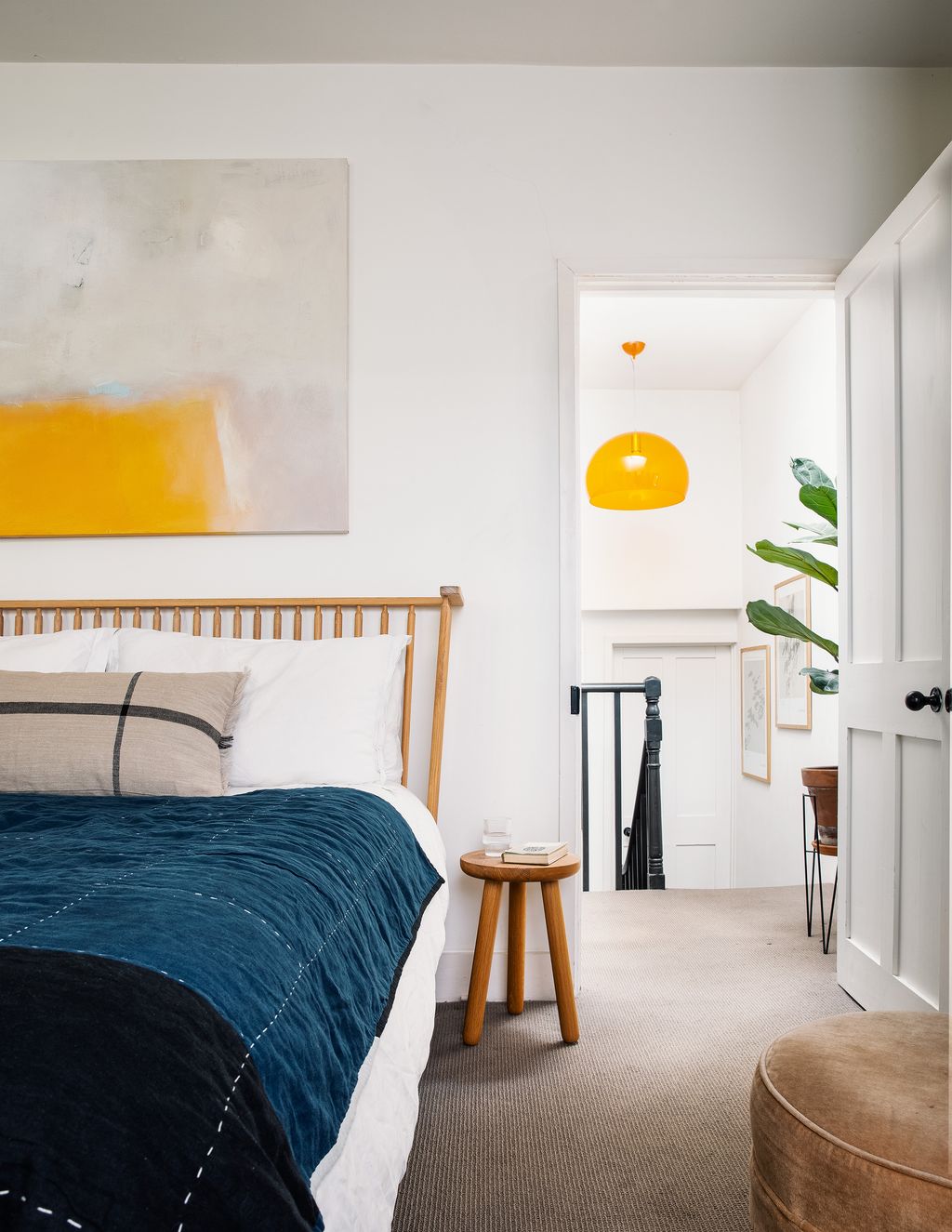 A bed by Ilse Crawford is the focal point in the main bedroom.