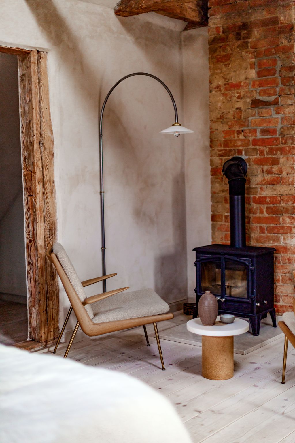 The chair is Tradition's ‘Boomerang chair the lamp is from Valerie Objects.