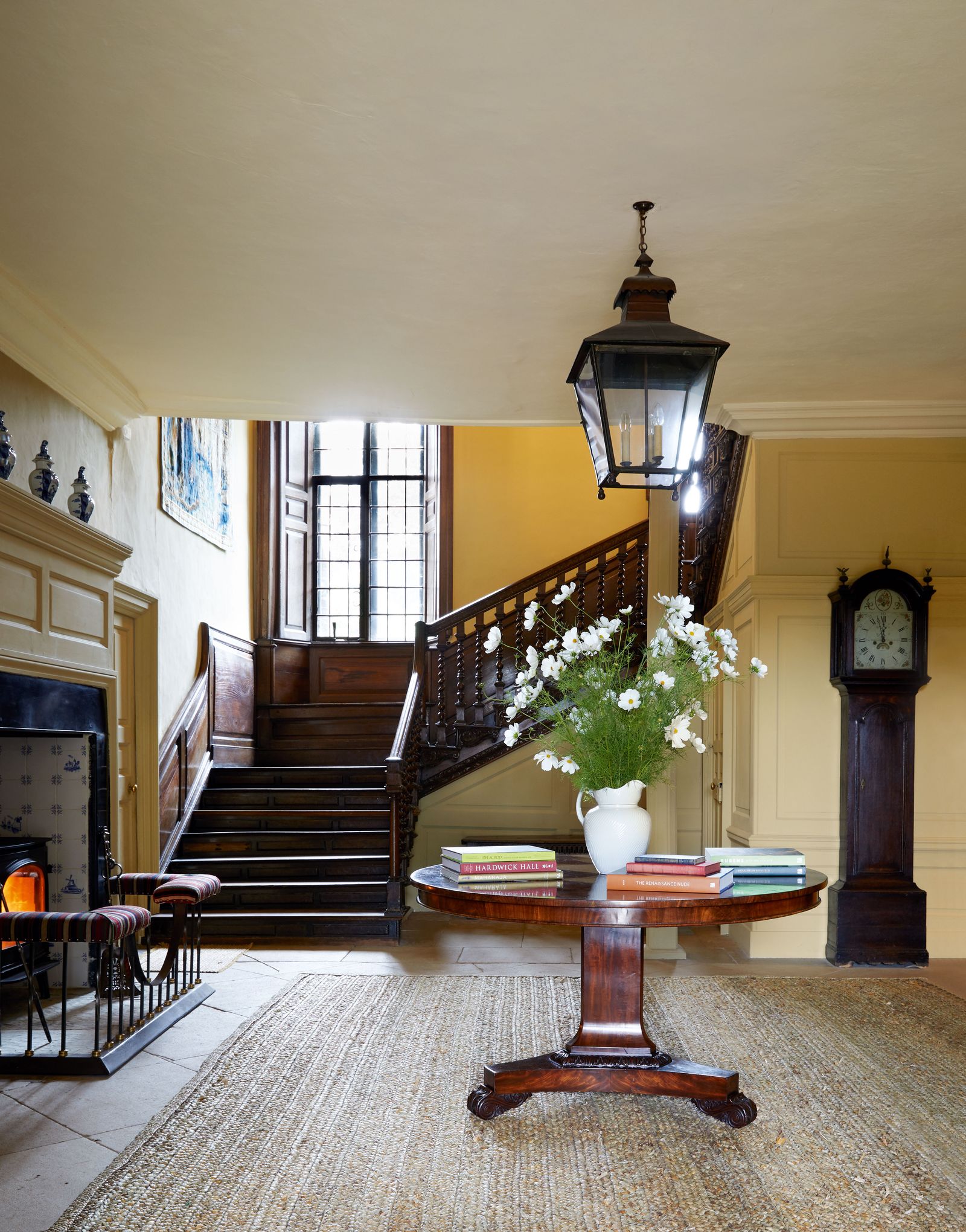 A William IV breakfast table from Ron Green anchors the bespoke floorcovering from Rush Matters on the original...