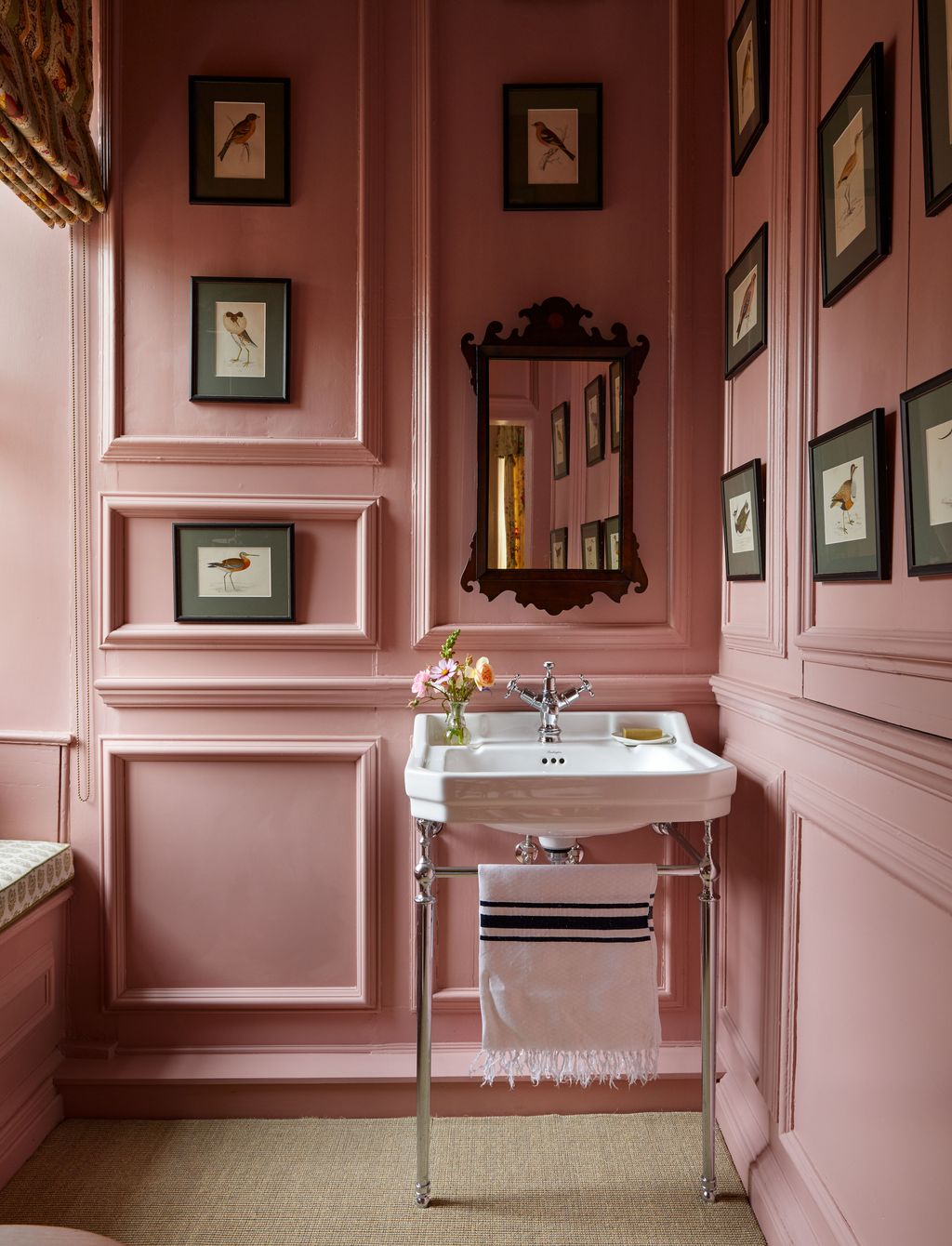 In the small downstairs bathroom in a Norfolk country house Carlos Garcia has cleverly saturated the walls in a rich...