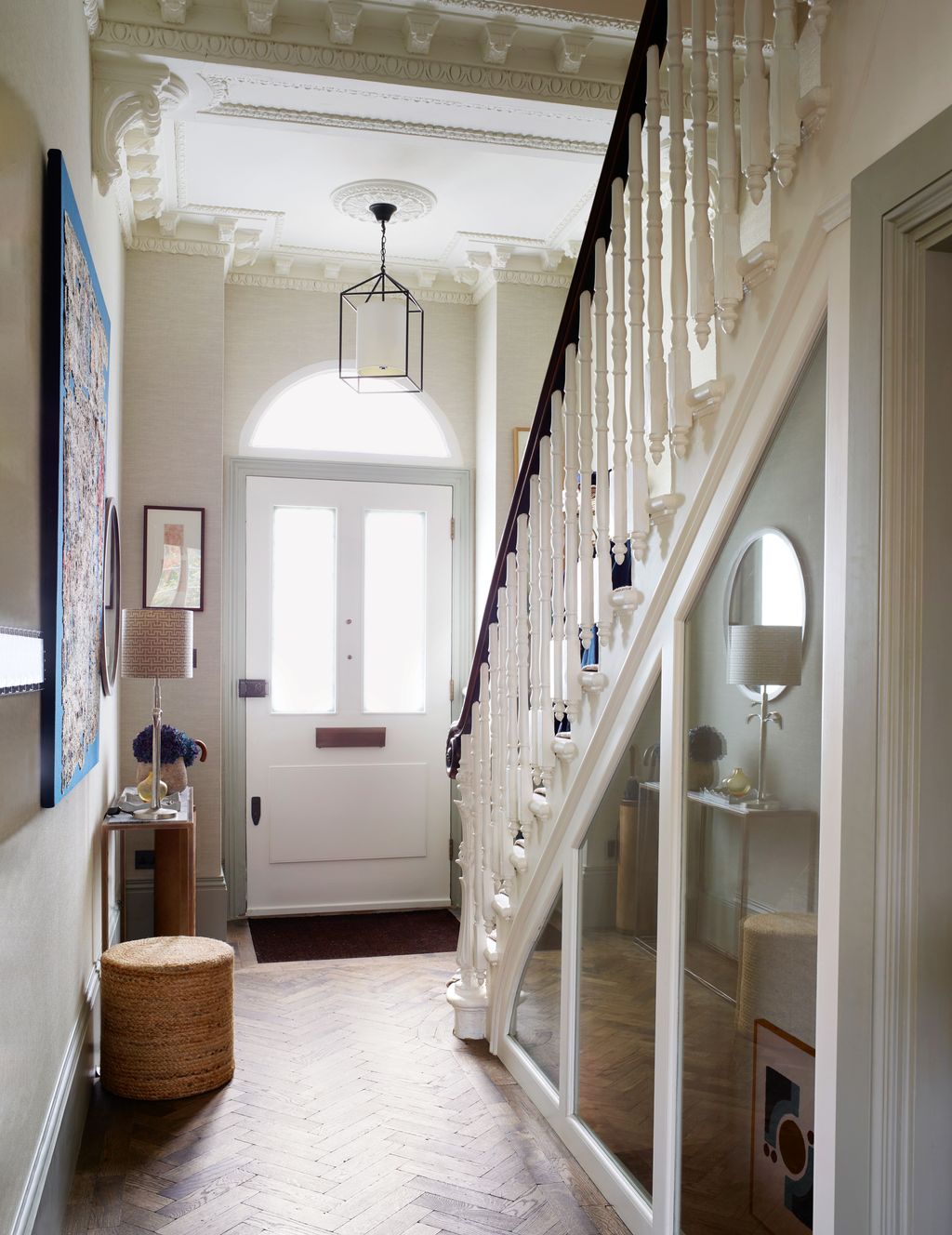 The original staircase was refurbished and glass panels inserted to bring light into the basement.