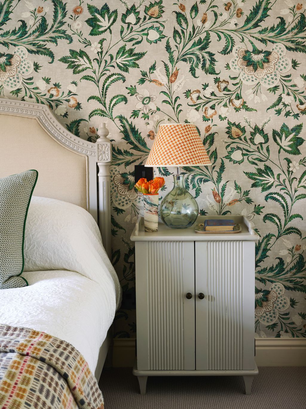 A Rosi de Ruig lampshade and wool throw from FelinFach pick up on Lewis Woods ‘Coromandel wallpaper in malachite.