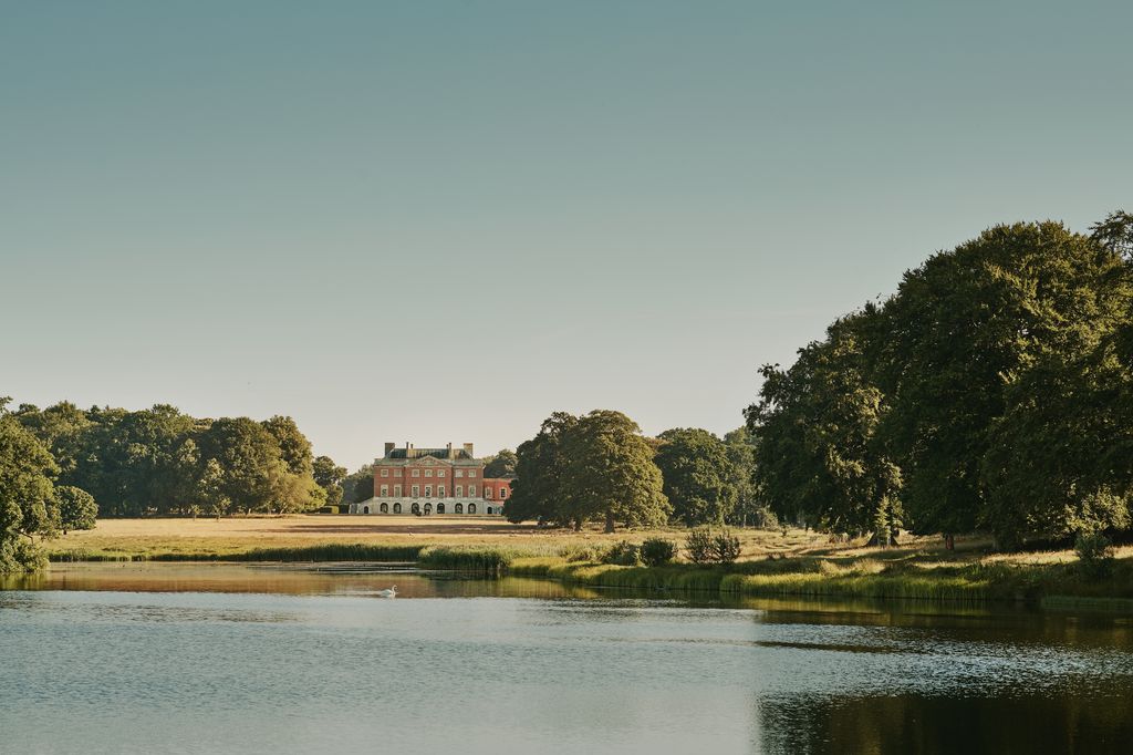 The south side of the magnificent Palladian house seen from the lake. It is surrounded by 500 acres of naturalistic...
