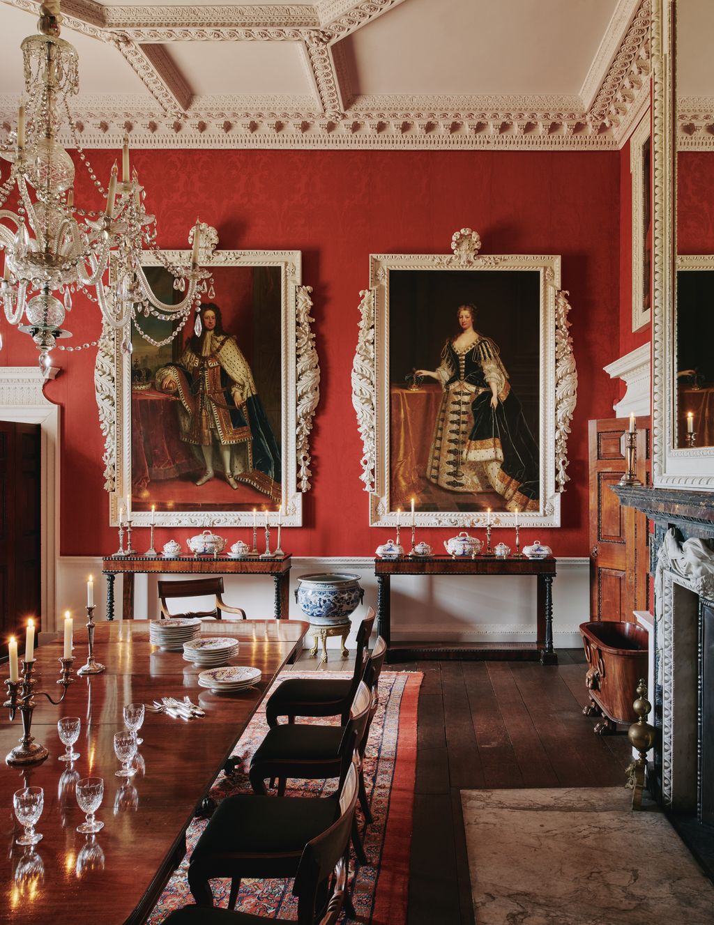 A glazed scarlet wool damask wallcovering also used in Horace Walpoles Strawberry Hill House is a foil for portraits...