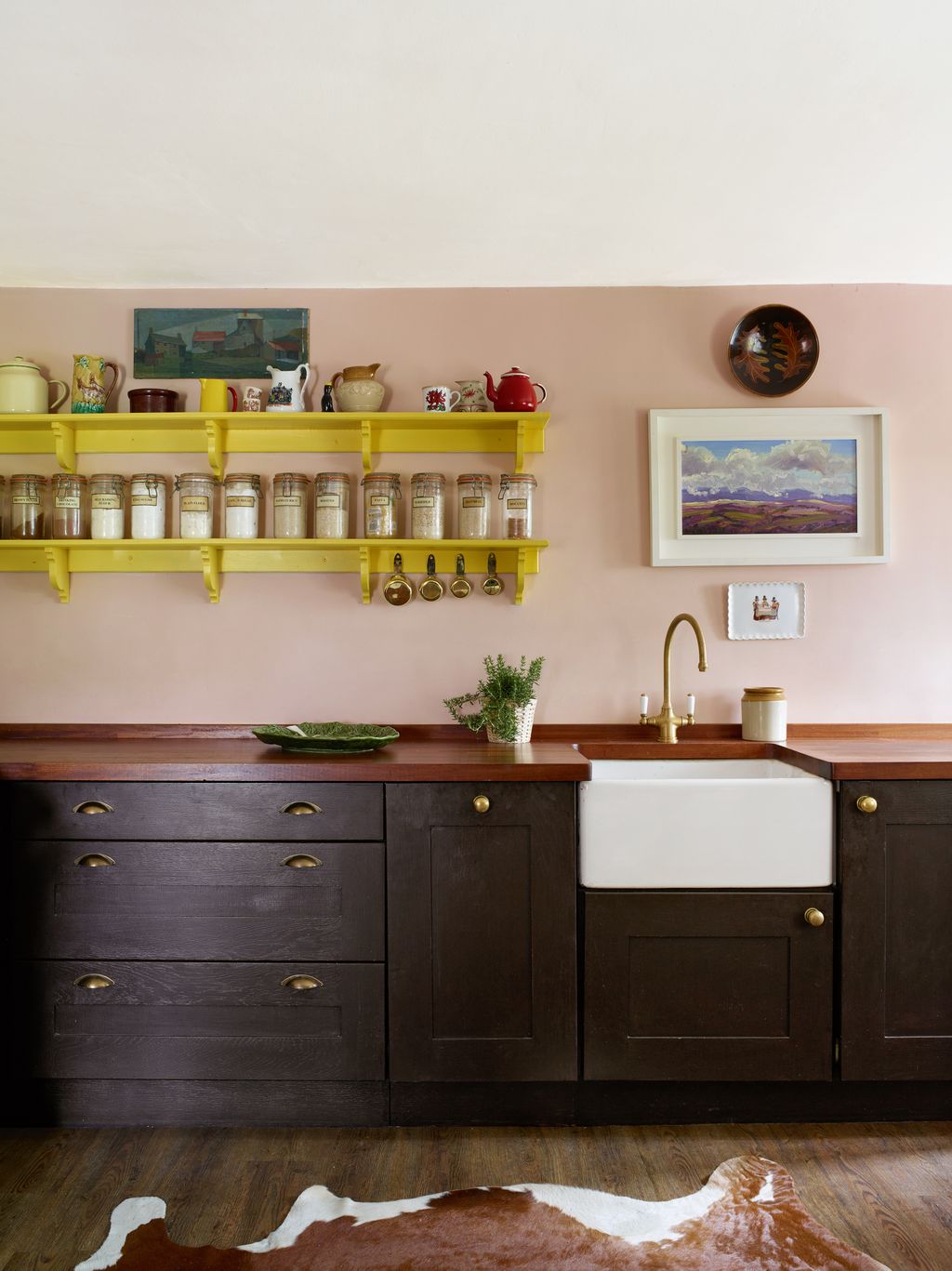 The kitchen in interior designer Lucinda Griffith's Welsh cottage beautifully blends pink and brown with Farrow  Ball's...