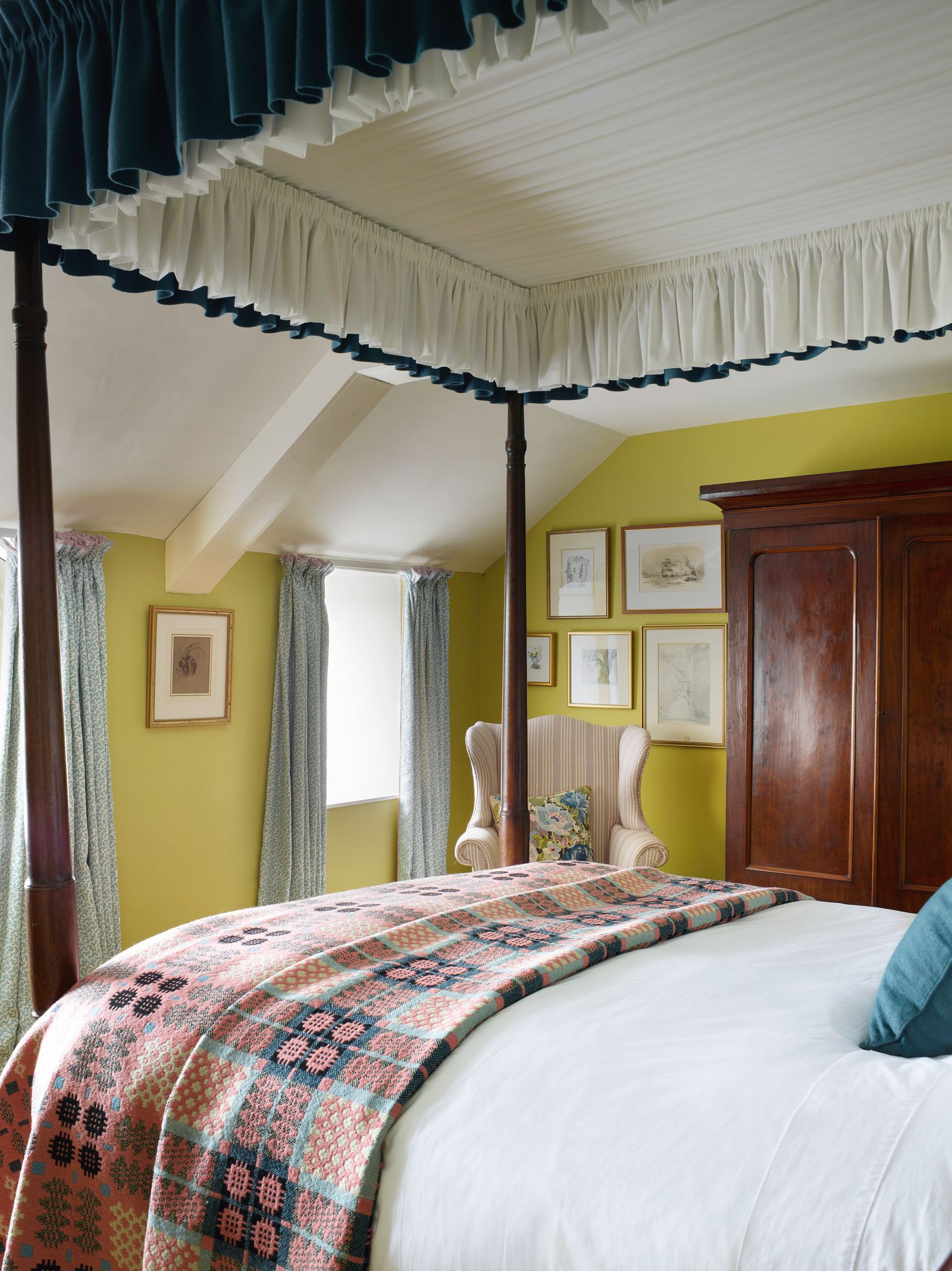 A bedroom in Fenwick and Tilbrook's 'Kelp' and Colefax's ‘Seafern Aqua one of interior designer Lucinda Griffith's...