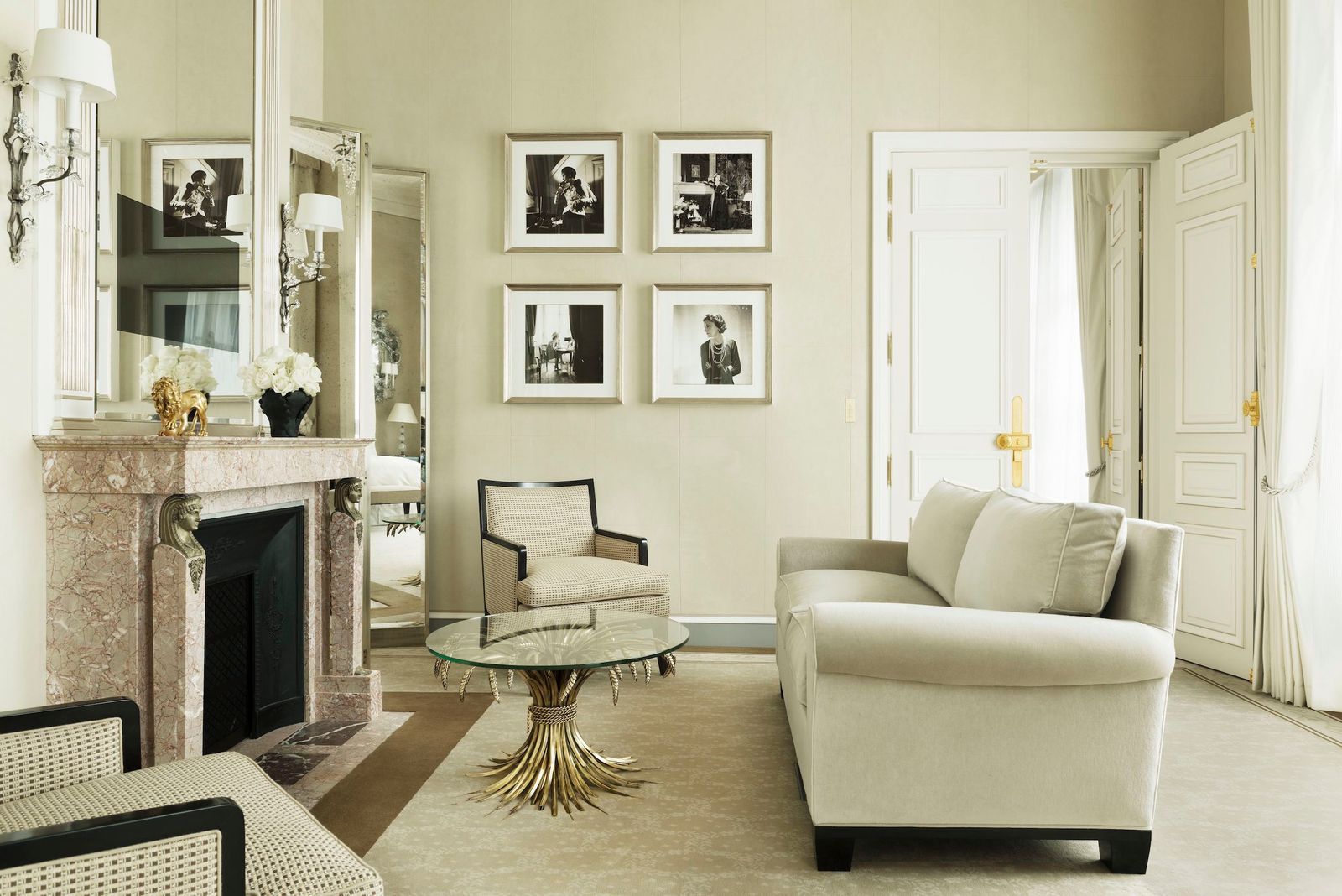 black and white hotel room with images of Coco Chanel