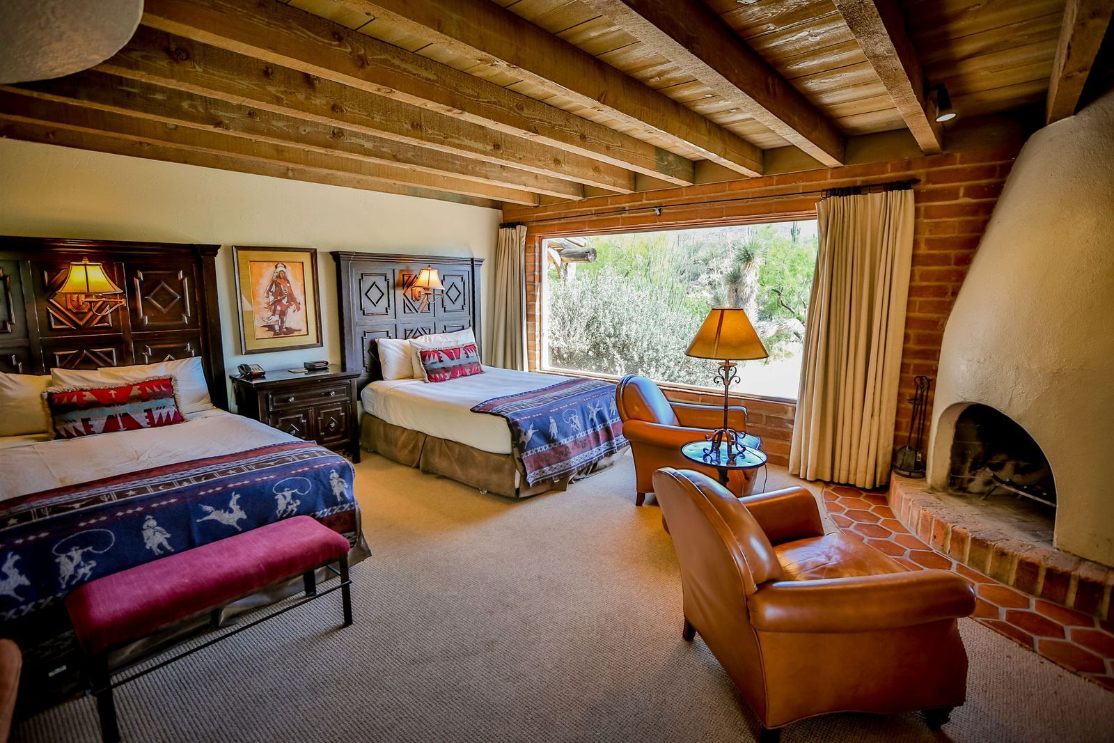 a southwestern inspired guest room with two beds