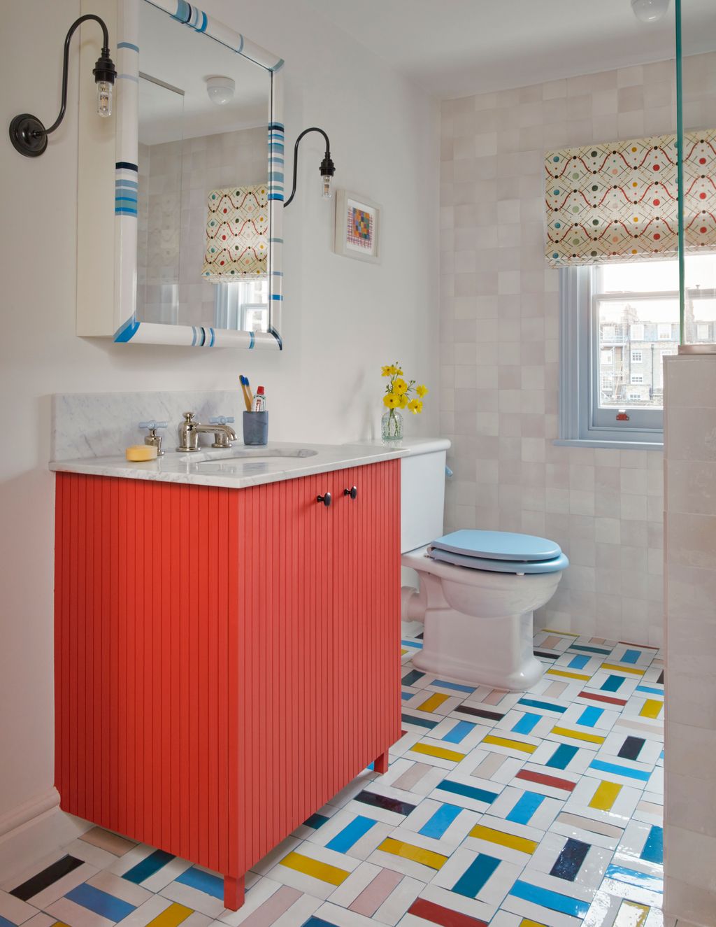A playful floor is the centrepiece in the children's bathroom with Mosaic Factory tiles in multiple colours laid in a...