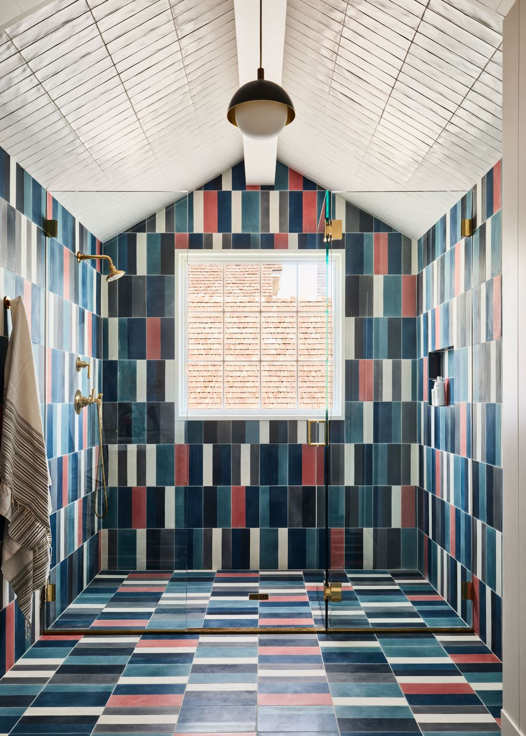 Colorful encaustic cement tiles fromnbspPopham Design dominate this walkin shower.