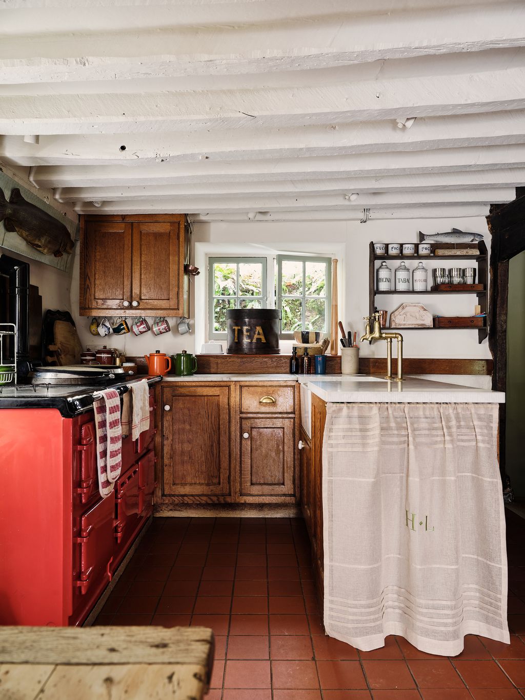 The kitchen was installed by the previous owner. An Irish linen curtain embroidered with ‘H.L” thenbsp initials of the...