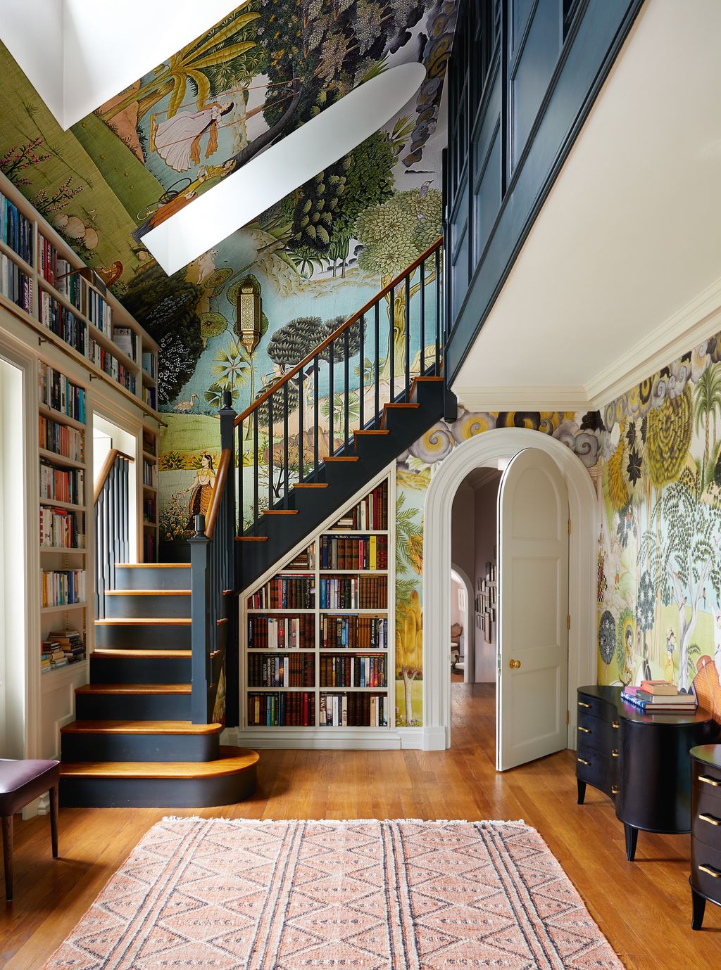 Iksel Decorative Arts ‘D Rajput Fantasy wallpaper provides a vibrant backdrop for the staircase in Little Greenes ‘Lamp...