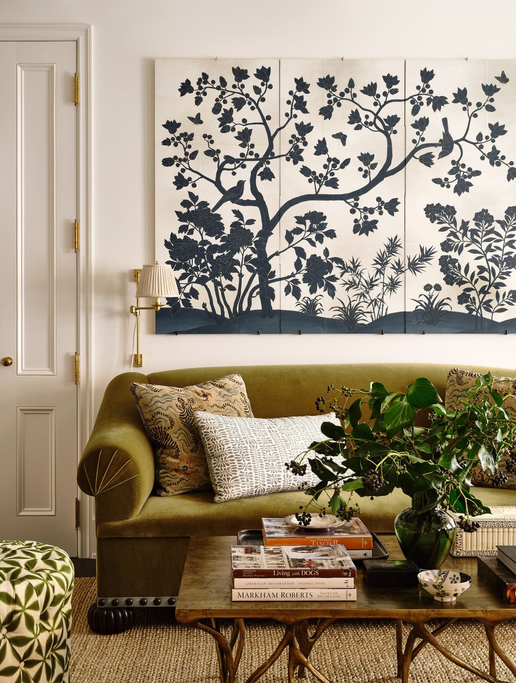 The olive green sofa upholstered in a fabric by Fabricut is one of Lilse's favourite pieces in the flat. The colour...