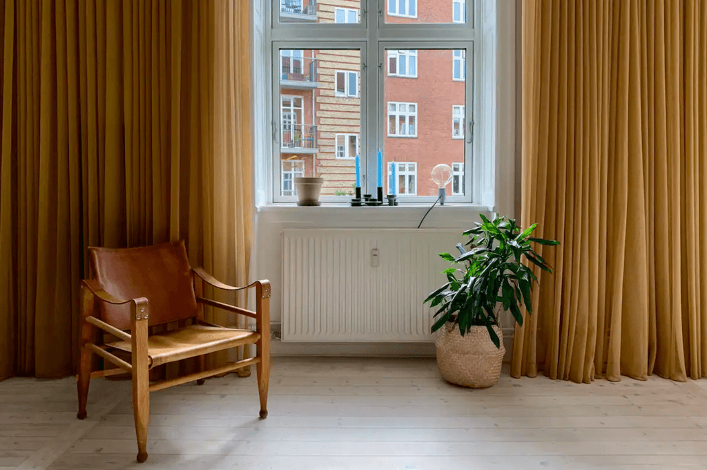 Blond timber floors covered in soft rugs colourful artwork and midcentury modern furnishings will greet guests at this...