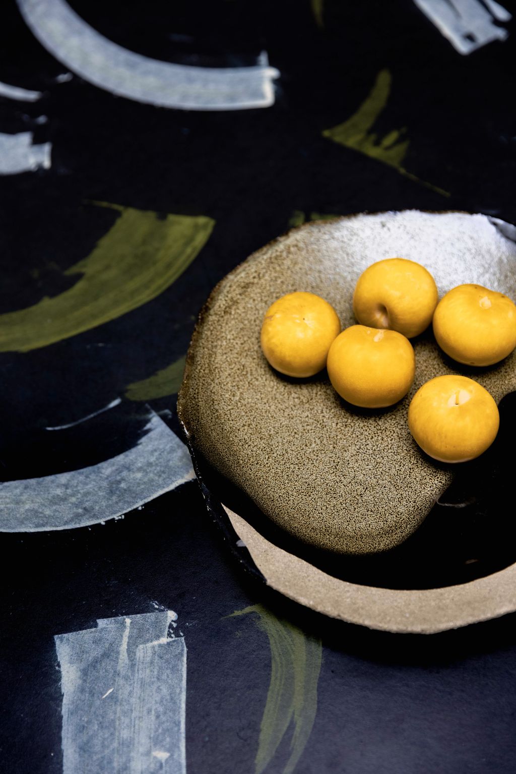 The dining table top is a custom design by Lishan from Smile Plastics.