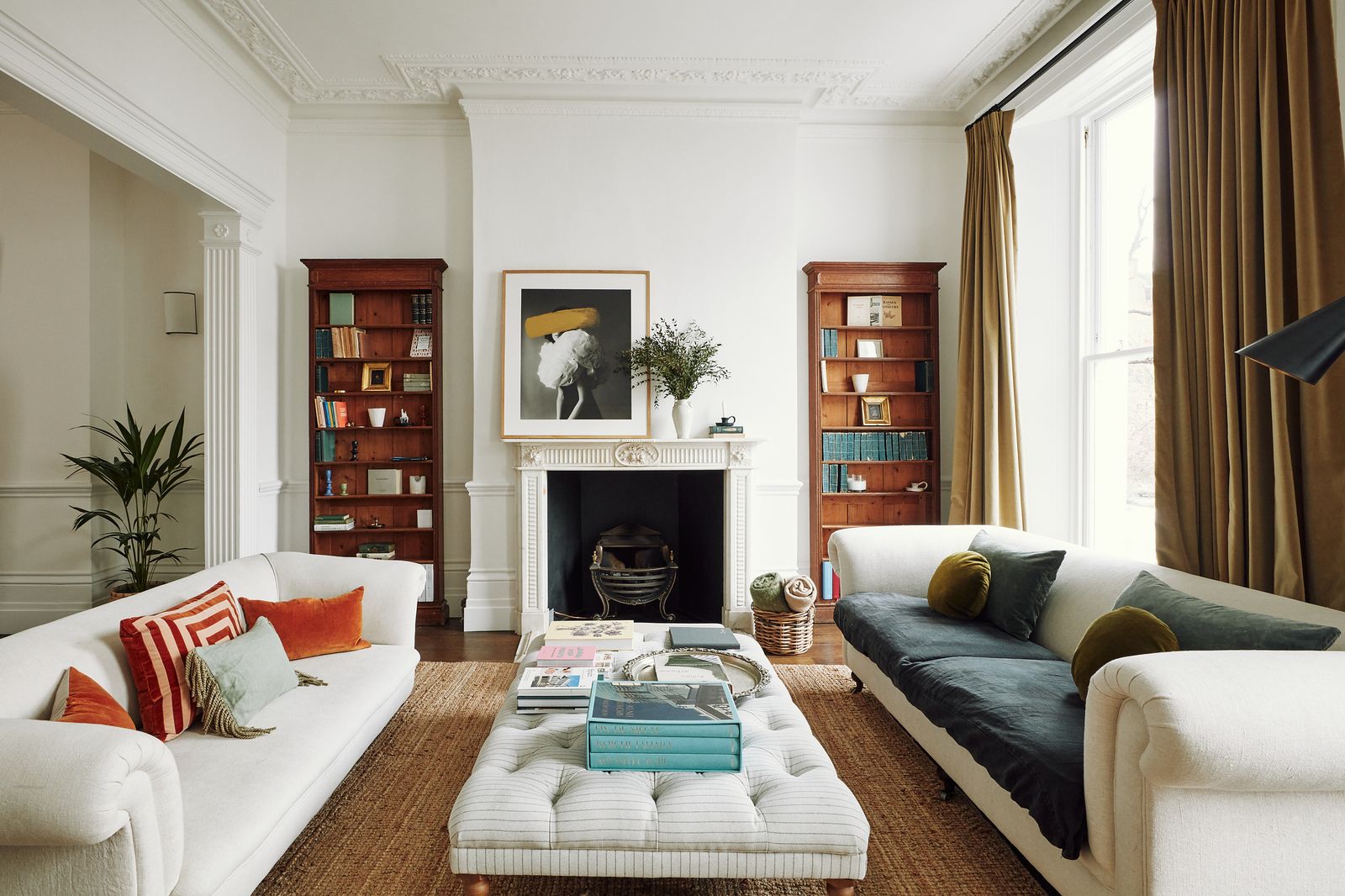 The sofas in Juana's sitting room are from Etsy and are paired with a footstool from Sofa.com. The large artwork is from...